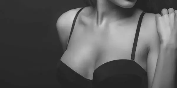 Woman considering breast lift mastopexy in Tampa Bay